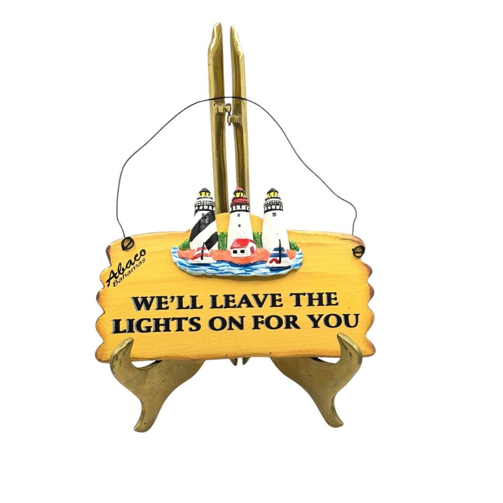 Wooden Lighthouse Hanging Sign With "We'll Leave The Lights On For You" Text